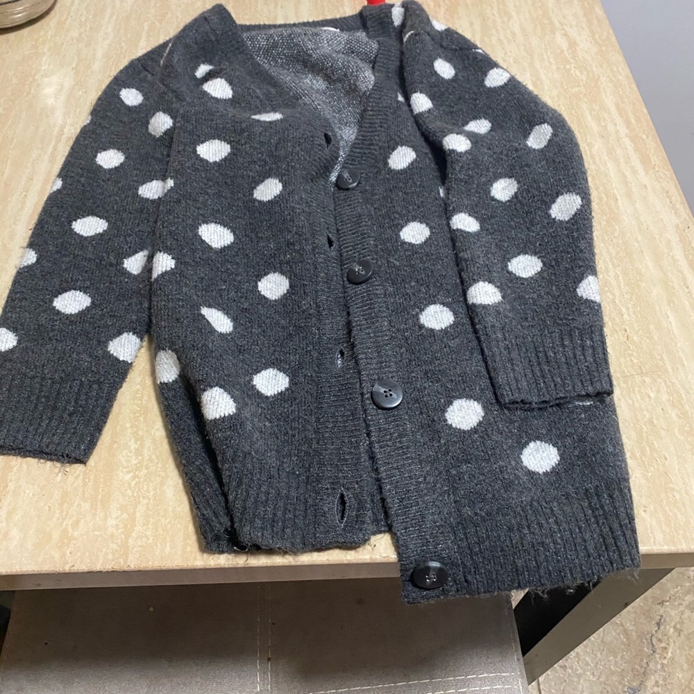 A gray sweater with polkadots
